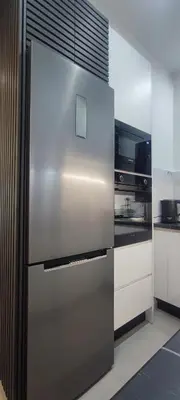 a large stainless steel refrigerator in a kitchen at Napoleon Modern apartment in Athens - Victoria Station in Athens