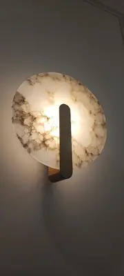 a light hanging from a ceiling with a stone at Napoleon Modern apartment in Athens - Victoria Station in Athens