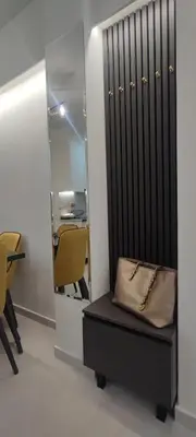 a purse sitting on a bench in front of a mirror at Napoleon Modern apartment in Athens - Victoria Station in Athens