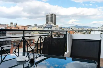 a view of the city from the balcony of a building at Elysian Lycabettus - Horizon in Athens