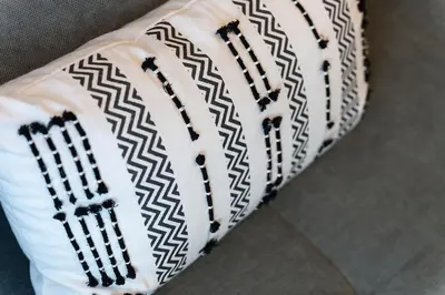 a pair of white socks with a black and white pattern at Elysian Lycabettus - Horizon in Athens