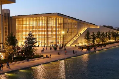 a large building with a christmas tree in front of it at Athens Riviera City Escape in Athens
