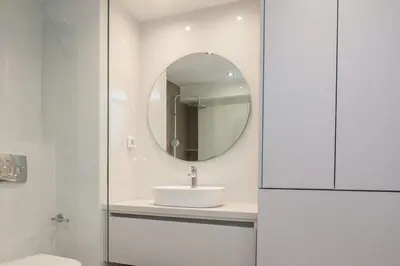 a bathroom with a sink and a mirror at Fresh Modern 1 Bd Apt in Quiet Agia Paraskevi in Athens
