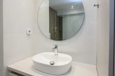 a white bathroom with a sink and a mirror at Fresh Modern 1 Bd Apt in Quiet Agia Paraskevi in Athens
