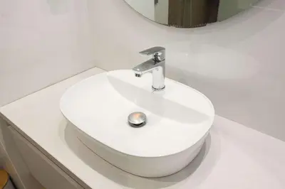 a bathroom with a white sink and a mirror at Fresh Modern 1 Bd Apt in Quiet Agia Paraskevi in Athens