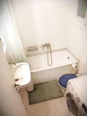 a bathroom with a tub and a sink and a toilet at Charming Plaka Retreat in Athens in Athens