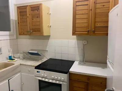 a kitchen with a stove and a sink at Charming Plaka Retreat in Athens in Athens