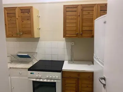 a kitchen with a stove and a refrigerator at Charming Plaka Retreat in Athens in Athens