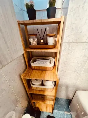 a wooden shelf in a bathroom with a toilet at Acropolis View Funky House in Athens