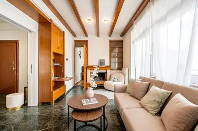 a living room with a couch and a table at Houseloft The Viewpoint Athens in Athens