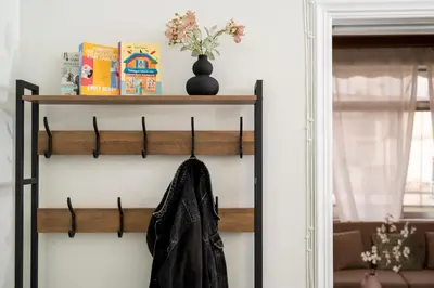 a coat hanging on a shelf in a living room at Houseloft The Viewpoint Athens in Athens