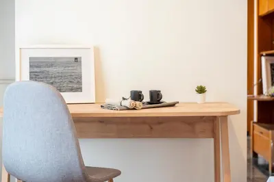 a desk with a chair and a picture on it at Houseloft The Viewpoint Athens in Athens
