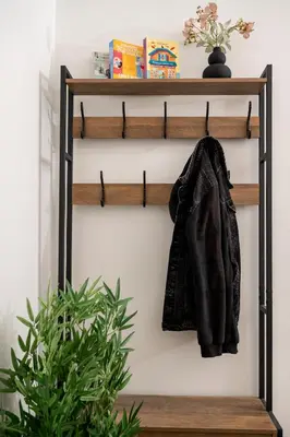 a coat hanging on a shelf in a room with a plant at Houseloft The Viewpoint Athens in Athens