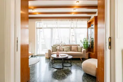 a living room with a couch and a table at Houseloft The Viewpoint Athens in Athens