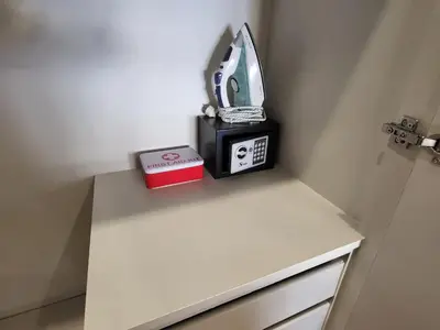 a counter with a alarm clock and a box on it at POSEIDON Executive Suite in Athens
