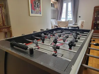 a group of foosball tables in a living room at POSEIDON Executive Suite in Athens