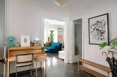 a living room with a desk and a blue couch at Unique 2BD 2BA Design Apt with airconditioning near Acropolis in Athens