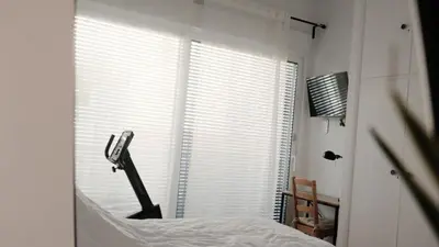 a bedroom with a bed and a window with blinds at Unique 2BD 2BA Design Apt with airconditioning near Acropolis in Athens