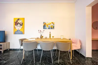 a dining room with a table and chairs at Stylish Luxury Getaway 3BR Apartment 115m in Athens