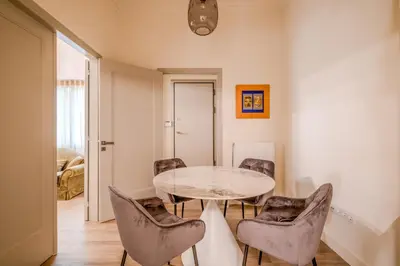 a dining room with a glass table and chairs at The Athenian Elegance , Luxury 2 br near Hilton District in Athens