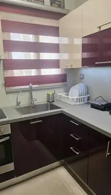 a kitchen with a sink and a counter top at Lydia Apartment Comfortable 2BR near Hospital in Athens