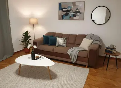 a living room with a couch and a table at Elektra Residence 2Bd Apartment in Monastiraki in Athens