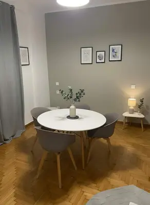 a dining room with a table with a plant on it at Elektra Residence 2Bd Apartment in Monastiraki in Athens