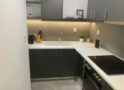 a kitchen with a sink and a stove at Elektra Residence 2Bd Apartment in Monastiraki in Athens
