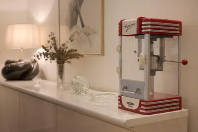 a red sewing machine sitting on top of a counter at Spacious & central 2BR apt in Agia Paraskevi in Athens