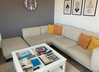 a living room with a couch and a coffee table at Under the Gaze of the Acropolis 2-Bb Athenian Apt in Athens