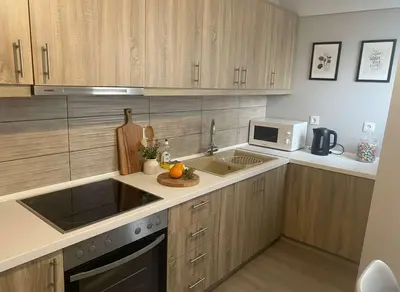 a kitchen with a sink and a microwave at Under the Gaze of the Acropolis 2-Bb Athenian Apt in Athens