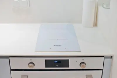 a microwave oven sitting on top of a stove at Radiant Voula Studio, a stone's throw from the Sea in Athens