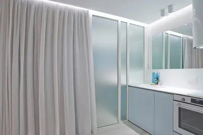 a kitchen with a shower curtain and a sink at Radiant Voula Studio, a stone's throw from the Sea in Athens