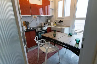 a small kitchen with a table and a counter top at Noir Luxury 1 bedroom Atelier in Athens
