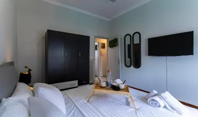 a living room with a couch and a table at Noir Luxury 1 bedroom Atelier in Athens