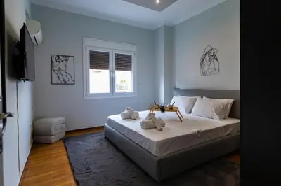 a bedroom with a bed with two teddy bears on it at Noir Luxury 1 bedroom Atelier in Athens