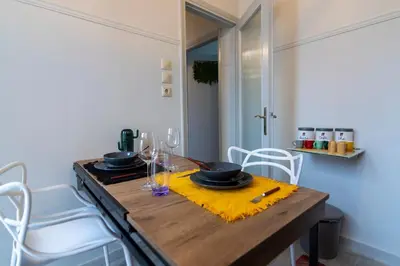 a dining room table with a yellow napkin and glasses at Noir Luxury 1 bedroom Atelier in Athens