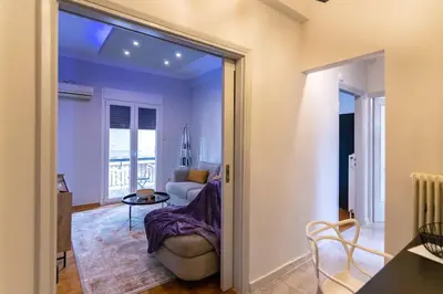 a living room with a couch and a table at Noir Luxury 1 bedroom Atelier in Athens