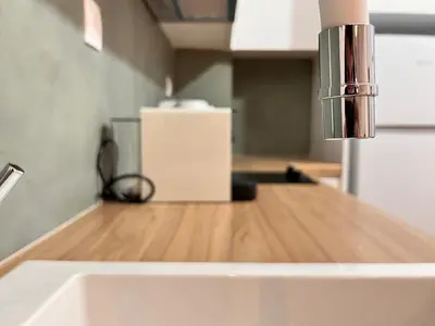 a kitchen counter with a sink and a faucet at Earthy Retreat in Central Athens Fully renovated in Athens