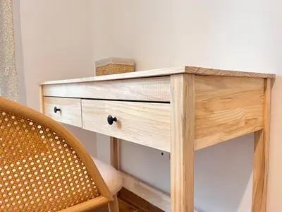 a wooden dresser in a room with a chair at Earthy Retreat in Central Athens Fully renovated in Athens