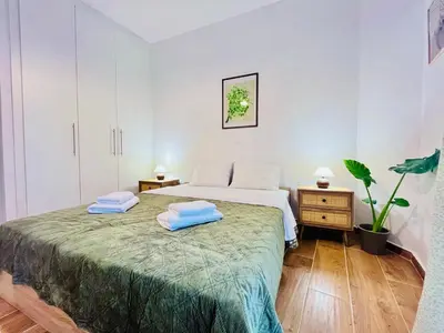 a bedroom with a bed with two towels on it at Earthy Retreat in Central Athens Fully renovated in Athens
