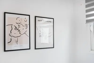 three framed art prints on a white wall at Elysian Lycabettus - Panorama in Athens