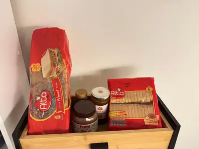 a drawer in a refrigerator filled with food and condiments at Aiolos Alimos Riviera super luxury Grand suite with gym in Athens