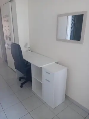 an office with a desk and a chair and a mirror at Celia's in Athens