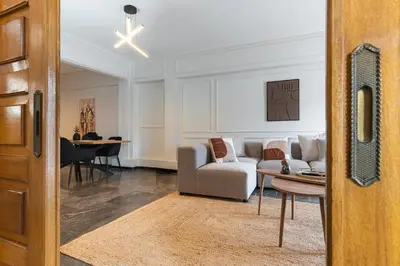 a living room with a couch and a table at Elegant 3 Bdr Apartment City Retreat in Kypseli in Mesochórion