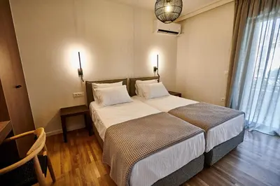 a bedroom with a large bed in a room at By the Ellinikon in Athens