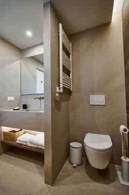 a bathroom with a toilet and a sink at By the Ellinikon in Athens