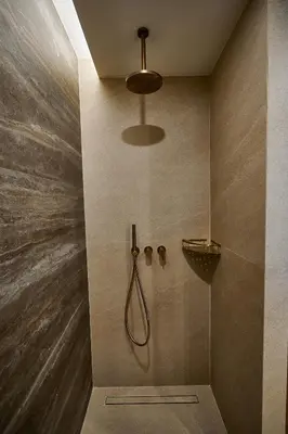 a bathroom with a shower with a shower head at By the Ellinikon in Athens