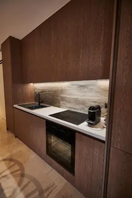 a kitchen with a sink and a stove at By the Ellinikon in Athens