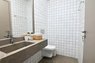 a bathroom with a sink and a toilet at Omonia Flow Two by ΜΡS in Athens